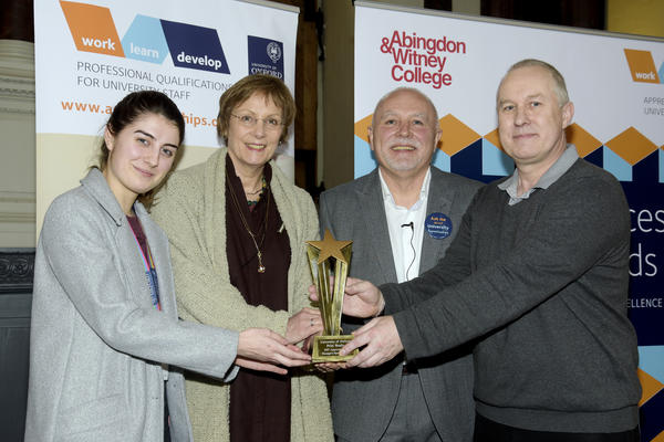 Manager Bob Malloy, and apprentice Jordan Morris from the print studio accepting their award from Clive Shepherd and the registrar Gill Aitken at the 2019 University Apprenticeship awards