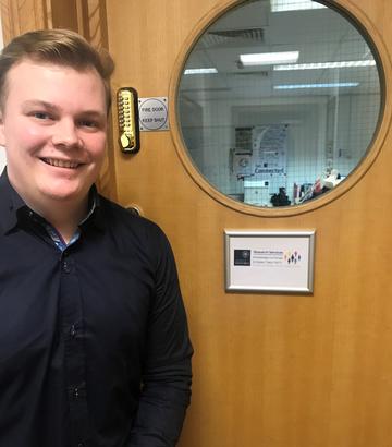 Apprentice Sam Jones, in the KEIT office sharing his apprenticeship story during National Apprenticeship Week