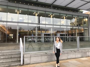 Said Business School Marketing Apprentice, Daniela Cazan outside SBS sharing her apprenticeship story